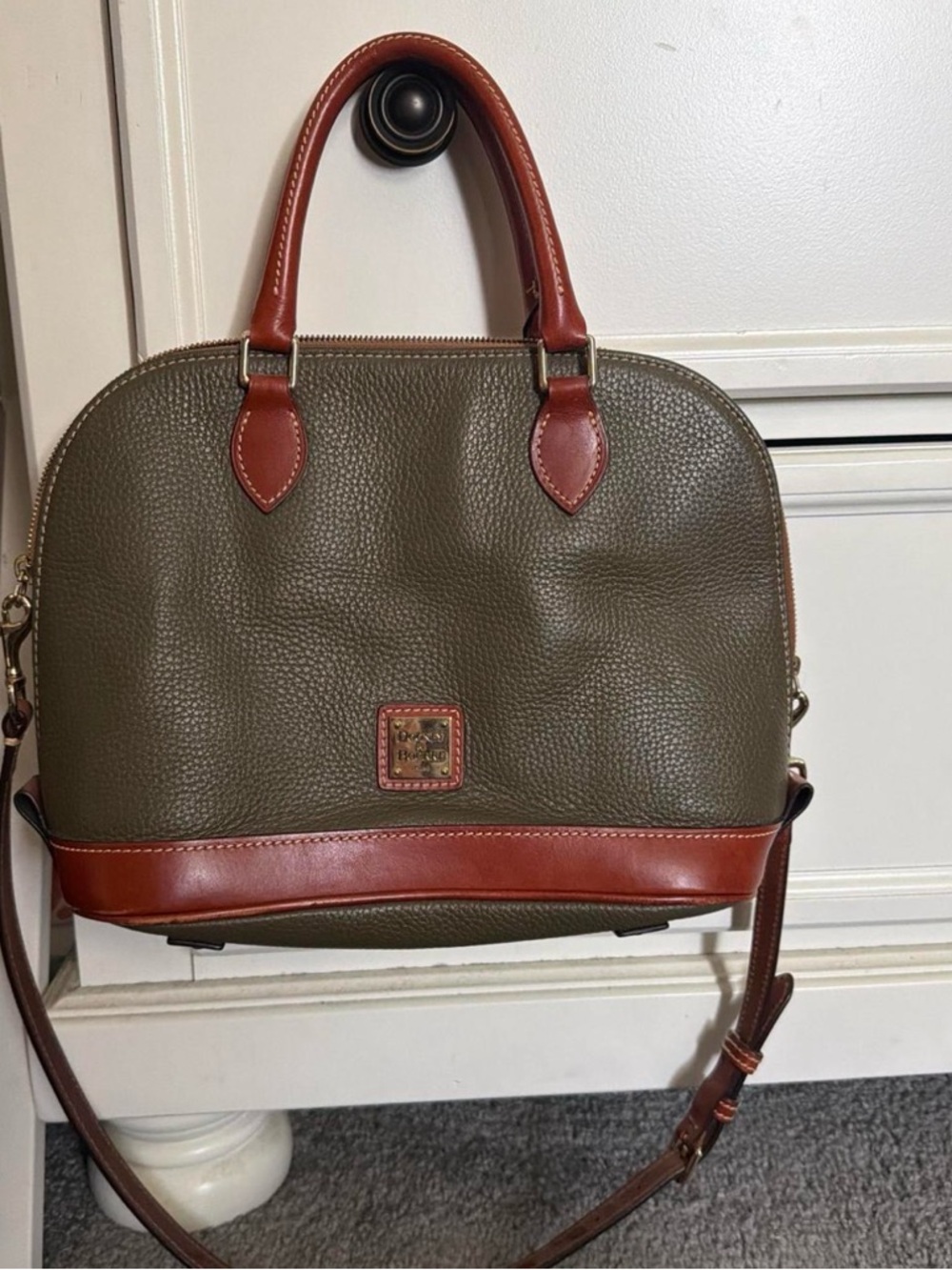 SOLD 

Dooney & Bourke Red Interior Leather Label with Brown Trim-